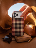 Christmas Eve tartan phone case lifted from a leather bag