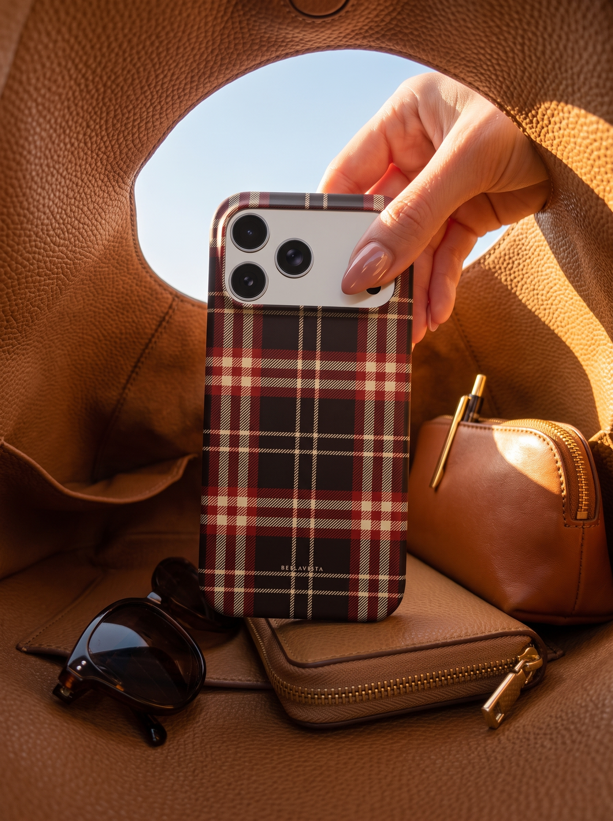 Christmas Eve tartan phone case lifted from a leather bag